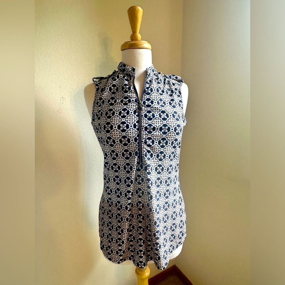 Sleeveless blouse with zipper. Size medium.